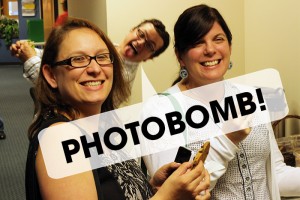 Amy Schultz and Lori Parks being photobombed by a fellow Leadercast 2014 attendee.